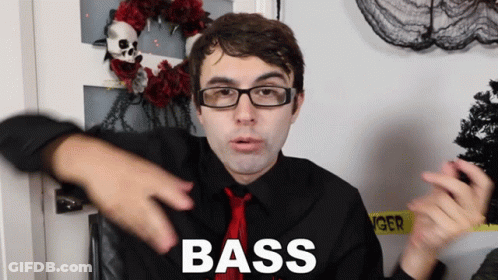 A Man With Glasses And A Red Tie Has The Word Bass On His Shirt GIF