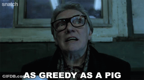 A Man With Glasses And A Scarf Says As Greedy As A Pig GIF