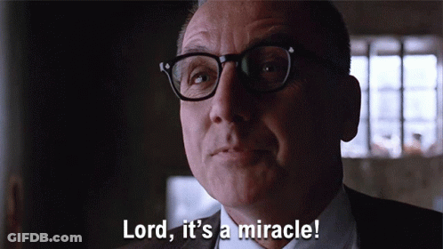A Man With Glasses And A Suit Says Lord It 'S A Miracle GIF