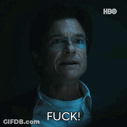 A Man With Glasses And A White Shirt Is Saying Fuck GIF