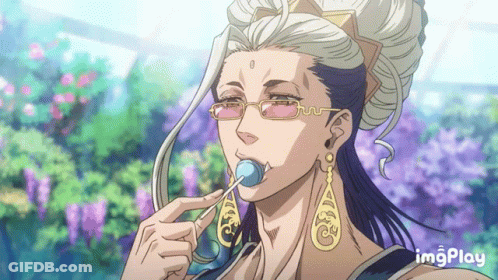 A Man With Glasses And Earrings Is Eating A Lollipop With Imgplay Written On The Bottom GIF