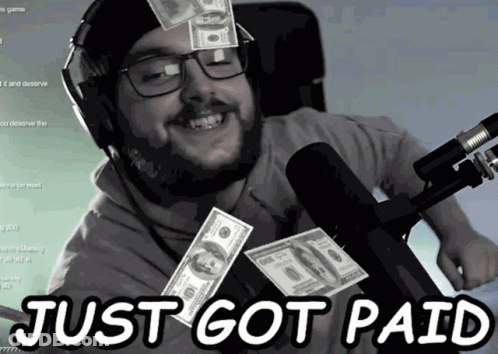 A Man With Glasses And Headphones Is Smiling With Money Falling Around Him And The Words Just Got Paid Above Him GIF