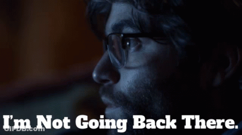 A Man With Glasses And The Words I 'M Not Going Back There Behind Him GIF