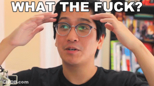 A Man With Glasses Has His Hands On His Head And The Words What The Fuck Are Above Him GIF
