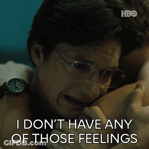 A Man With Glasses Hugging Another Man With The Words " I Don T Have Any Of Those Feelings " Below Him GIF