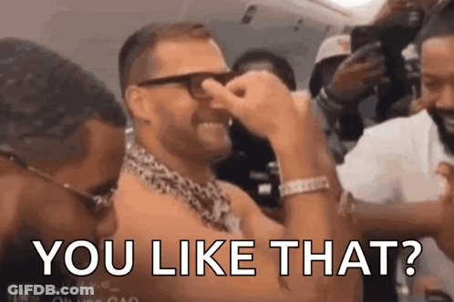 A Man With Glasses Is Covering His Nose With His Hand While Another Man Says You Like That ? GIF