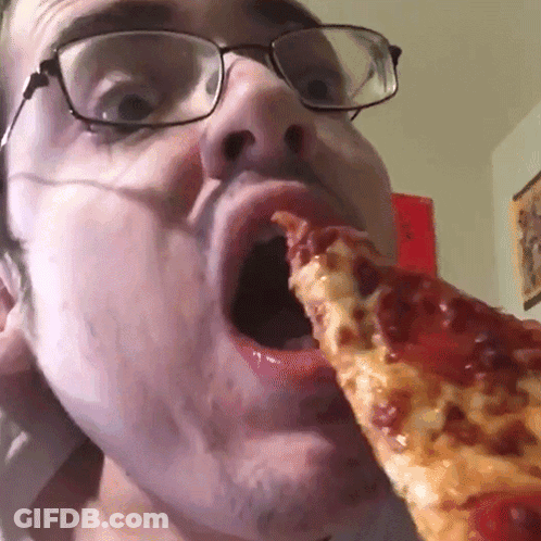 A Man With Glasses Is Eating A Slice Of Pepperoni Pizza GIF