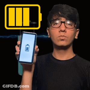 A Man With Glasses Is Holding A Cell Phone With A Battery Icon On It GIF