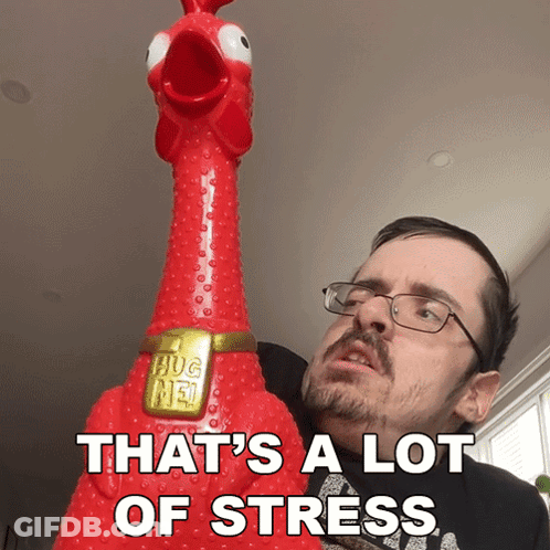 A Man With Glasses Is Holding A Chicken That Says Hug Me GIF