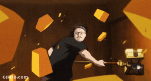 A Man With Glasses Is Holding A Hammer In A Room With Yellow Cubes Flying Around Him GIF