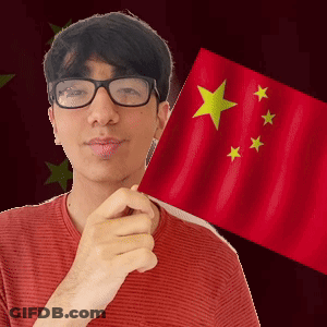 A Man With Glasses Is Holding A Red Flag With Yellow Stars On It GIF