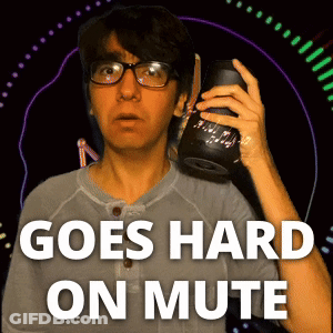 A Man With Glasses Is Holding A Speaker And The Words Goes Hard On Mute Are Above Him GIF