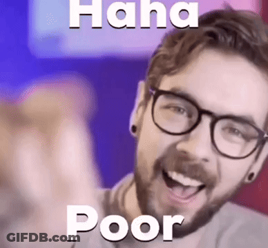 A Man With Glasses Is Laughing And Pointing At The Camera With The Words `` Haha Poor '' Above Him . GIF