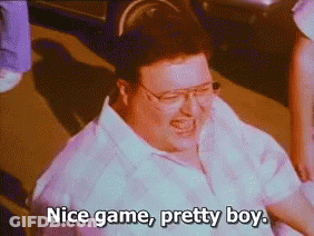 A Man With Glasses Is Laughing And Saying " Nice Game Pretty Boy " GIF