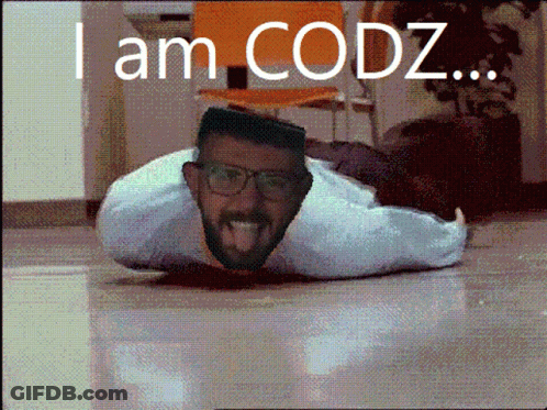 A Man With Glasses Is Laying On The Floor With The Words I Am Codz GIF