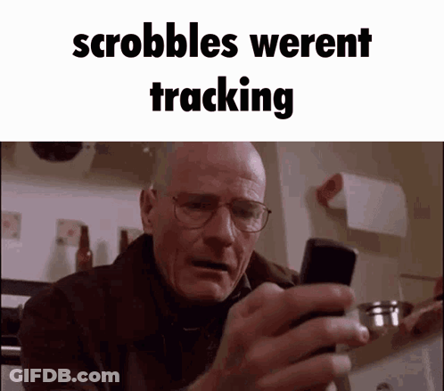 A Man With Glasses Is Looking At His Cell Phone With The Words Scrabbles Werent Tracking Above Him GIF