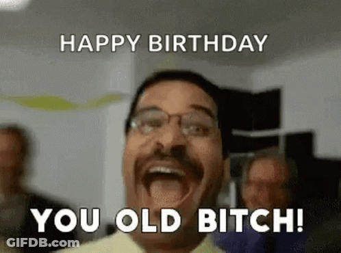 A Man With Glasses Is Making A Funny Face And Saying Happy Birthday You Old Bitch ! GIF