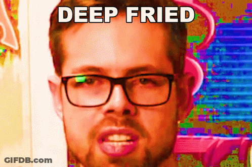 A Man With Glasses Is Making A Funny Face With The Words Deep Fried Written Above Him GIF