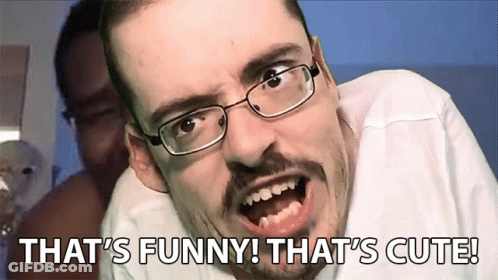 A Man With Glasses Is Making A Funny Face With The Words That 'S Funny That 'S Cute Behind Him GIF