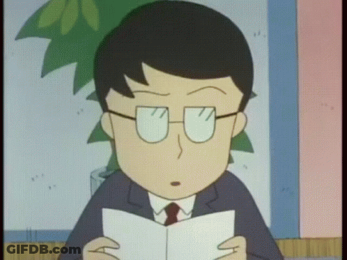 A Man With Glasses Is Reading A Book GIF