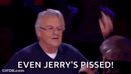 A Man With Glasses Is Sitting In Front Of A Group Of People And Says `` Even Jerry 'S Pissed ! '' GIF