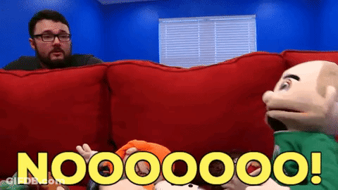 A Man With Glasses Is Sitting On A Red Couch Next To Two Puppets And Says Nooooo GIF