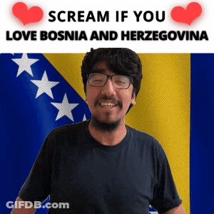 A Man With Glasses Is Smiling In Front Of A Flag With The Words Scream If You Love Bosnia And Herzegovina GIF