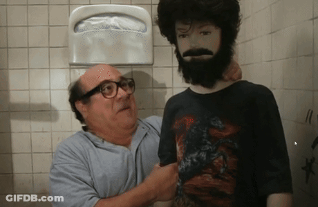A Man With Glasses Is Standing Next To A Man With A Beard GIF