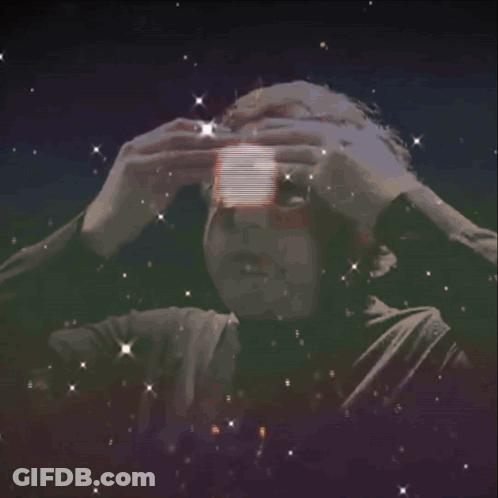A Man With Glasses Is Surrounded By A Light Circle GIF