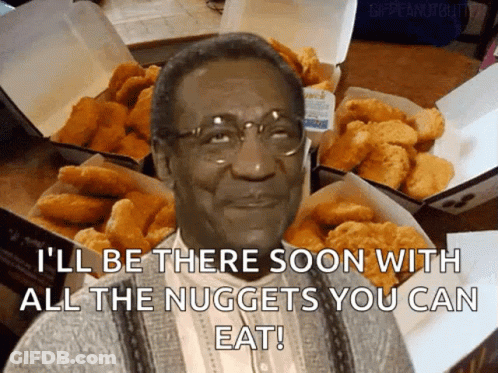 A Man With Glasses Is Surrounded By Boxes Of Nuggets And Says " I 'Ll Be There Soon GIF