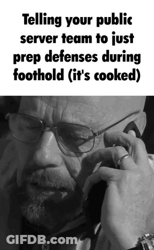 A Man With Glasses Is Talking On A Phone And The Caption Says Telling Your Public Server Team To Just Prep Defenses Duri GIF