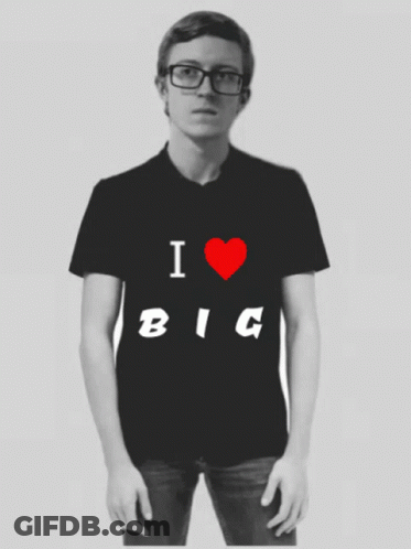 A Man With Glasses Is Wearing A Black Shirt That Says I Love Big GIF