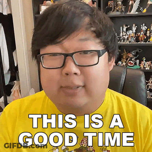 A Man With Glasses Is Wearing A Yellow Shirt That Says This Is A Good Time GIF