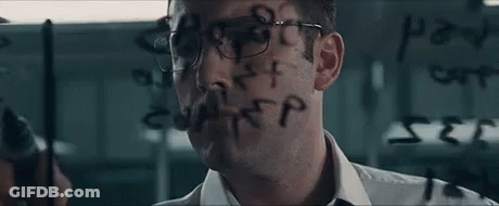 A Man With Glasses Is Writing On A Glass Wall With A Marker . GIF