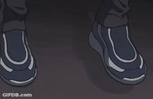 A Man With Glasses Looks Out Of A Window At Night GIF