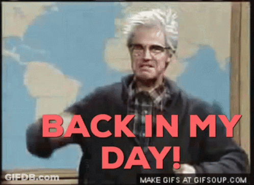 A Man With Glasses Says Back In My Day In Red Letters GIF