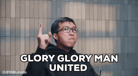 A Man With Glasses Says Glory Glory Man United With His Finger Up GIF