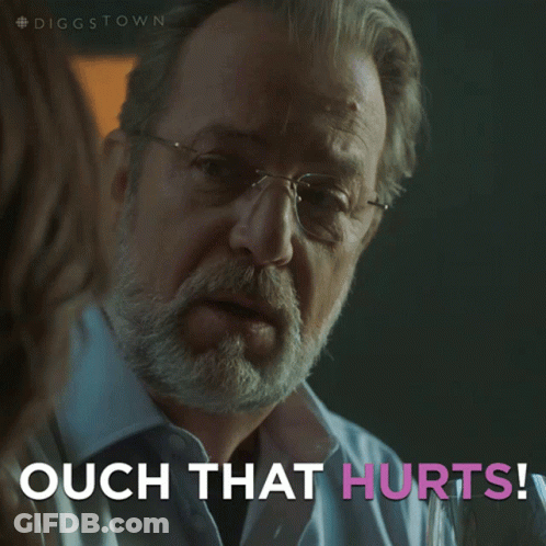 A Man With Glasses Says Ouch That Hurts In Pink Letters GIF