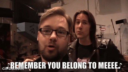 A Man With Glasses Says " Remember You Belong To Meeee " Next To Another Man GIF