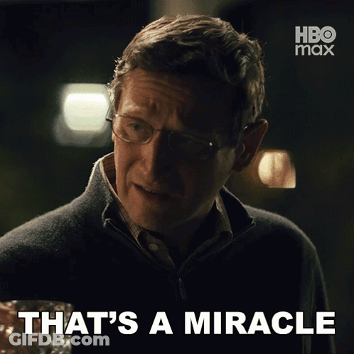 A Man With Glasses Says That 'S A Miracle With A Hbo Max Logo Behind Him GIF