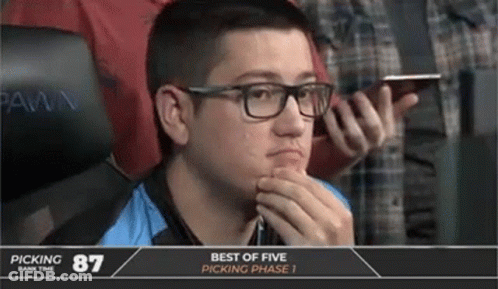 A Man With Glasses Sits In Front Of A Screen That Says Picking 87 GIF