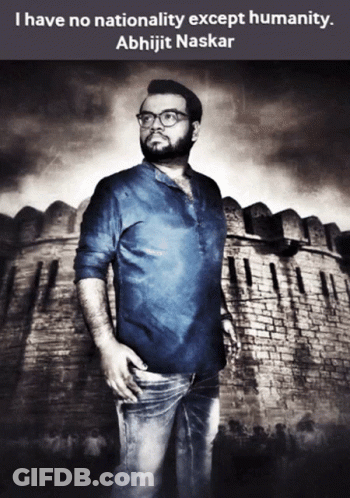 A Man With Glasses Stands In Front Of A Brick Wall With A Quote By Abhijit Naskar GIF
