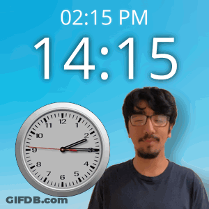 A Man With Glasses Stands In Front Of A Clock That Says 15:15 Pm GIF