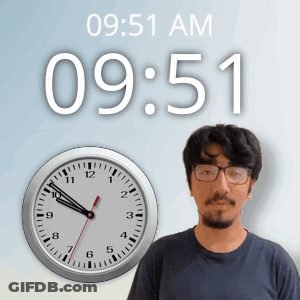 A Man With Glasses Stands In Front Of A Clock That Says 9:51 Am GIF