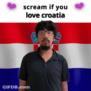 A Man With Glasses Stands In Front Of A Croatia Flag GIF