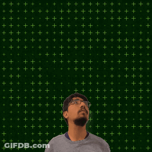 A Man With Glasses Stands In Front Of A Green Background With The Number 14 + 2 On It GIF
