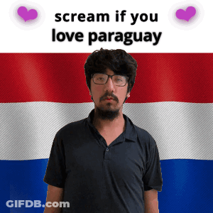 A Man With Glasses Stands In Front Of A Paraguay Flag And Says Scream If You Love Paraguay GIF