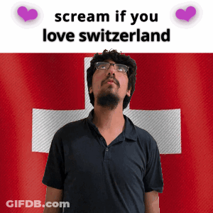 A Man With Glasses Stands In Front Of A Switzerland Flag And Says " Scream If You Love Switzerland " GIF