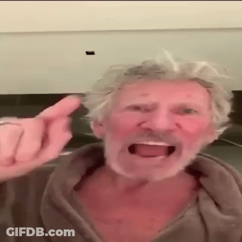 A Man With Gray Hair And A Beard Is Giving A Middle Finger GIF