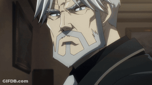 A Man With Gray Hair And A Beard Is Wearing A Black Jacket And Tie GIF